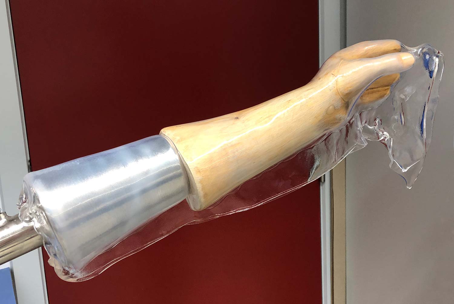 Drape-forming a high-temperature orthosis on a wooden model of a hand